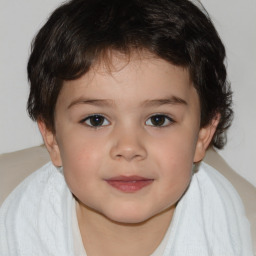 Joyful white child male with short  brown hair and brown eyes