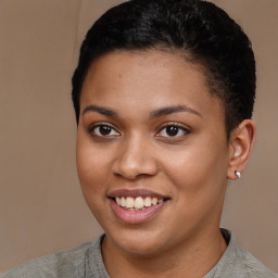 Joyful latino young-adult female with short  brown hair and brown eyes