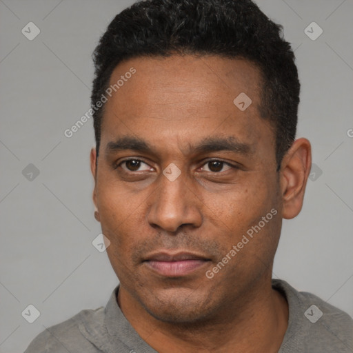 Neutral latino adult male with short  black hair and brown eyes