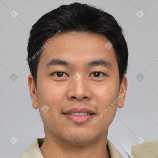 Joyful asian young-adult male with short  brown hair and brown eyes