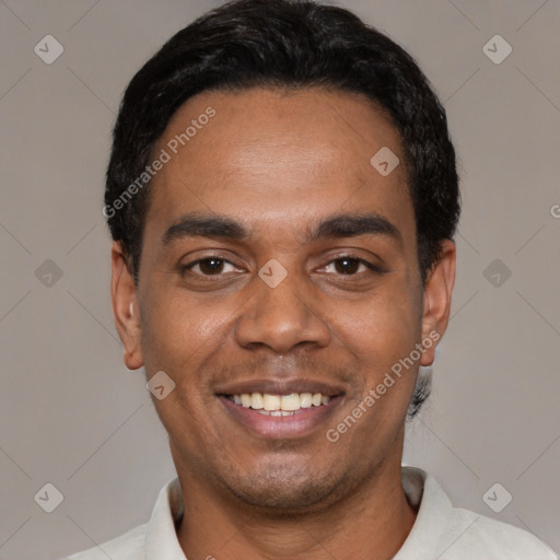 Joyful black young-adult male with short  black hair and brown eyes