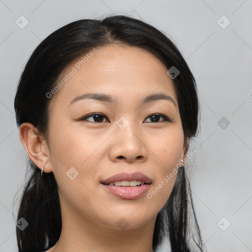 Joyful asian young-adult female with long  brown hair and brown eyes