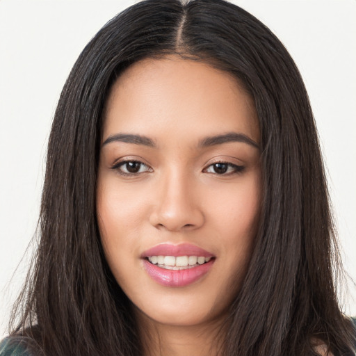 Joyful white young-adult female with long  black hair and brown eyes