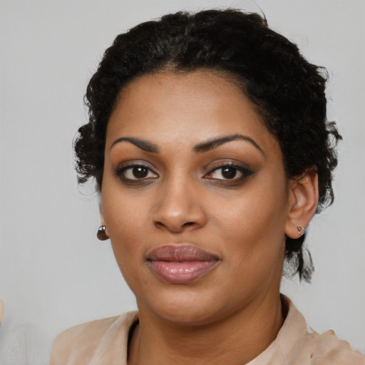 Joyful latino young-adult female with short  black hair and brown eyes