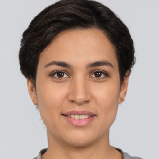 Joyful white young-adult female with short  brown hair and brown eyes