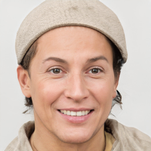 Joyful white adult female with short  brown hair and grey eyes