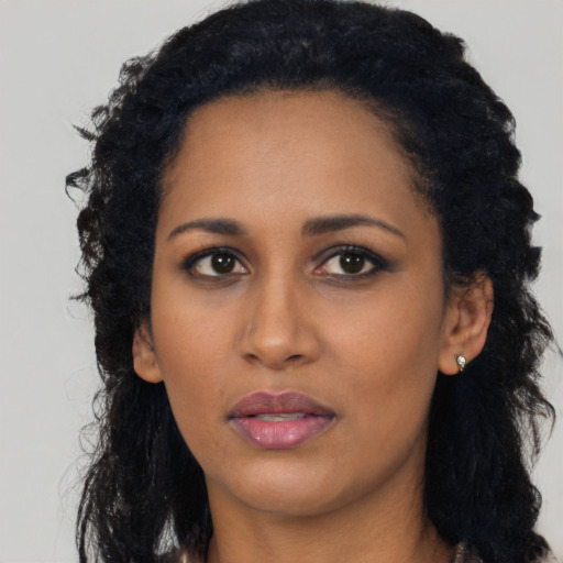 Neutral black young-adult female with long  black hair and brown eyes
