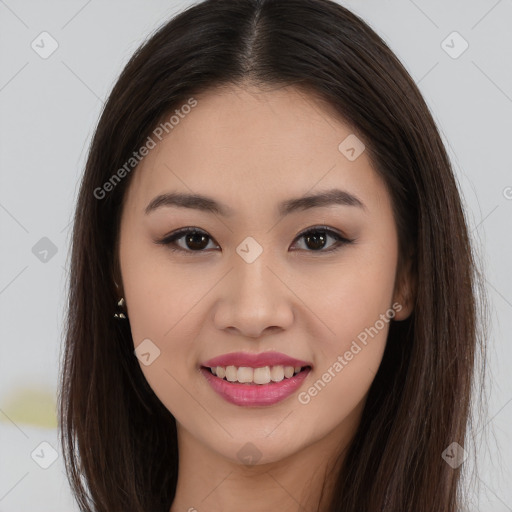 Joyful asian young-adult female with long  brown hair and brown eyes