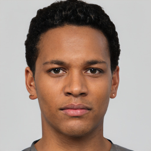 Neutral white young-adult male with short  black hair and brown eyes