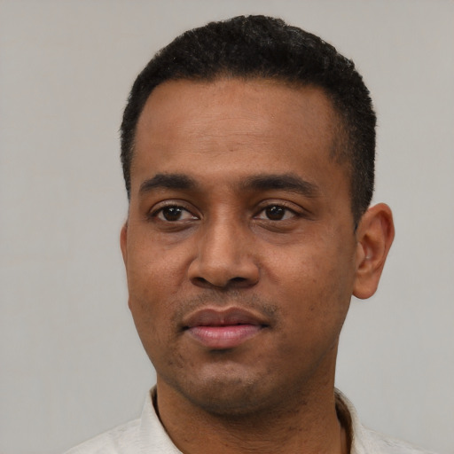 Neutral black young-adult male with short  black hair and brown eyes