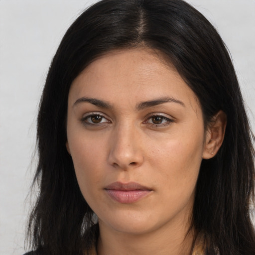 Neutral latino young-adult female with long  brown hair and brown eyes