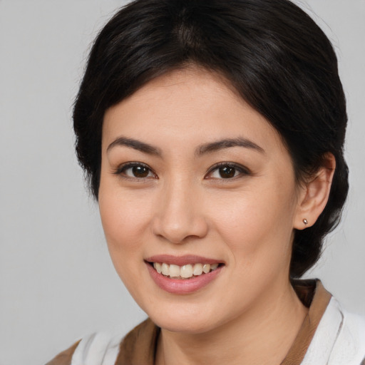 Joyful white young-adult female with medium  brown hair and brown eyes