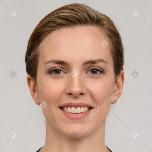 Joyful white young-adult female with medium  brown hair and grey eyes