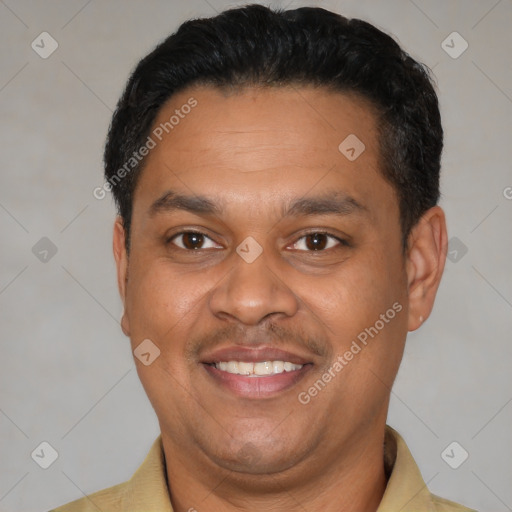 Joyful latino adult male with short  black hair and brown eyes