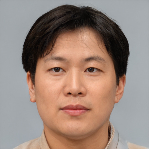 Neutral asian adult male with short  brown hair and brown eyes