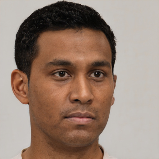 Neutral latino young-adult male with short  black hair and brown eyes