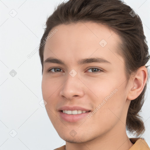 Joyful white young-adult male with medium  brown hair and brown eyes