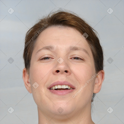 Joyful white adult male with short  brown hair and brown eyes