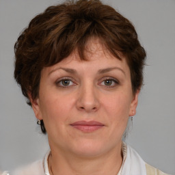 Joyful white adult female with short  brown hair and brown eyes