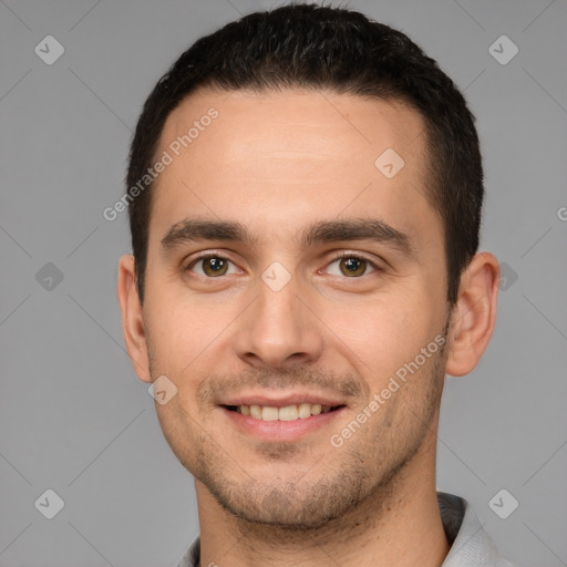Joyful white young-adult male with short  brown hair and brown eyes