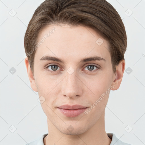 Joyful white young-adult male with short  brown hair and grey eyes