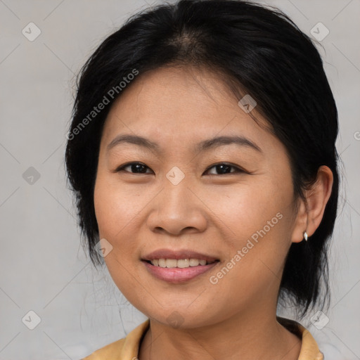 Joyful asian young-adult female with medium  brown hair and brown eyes