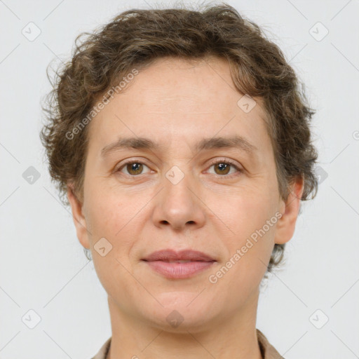 Joyful white adult female with short  brown hair and grey eyes