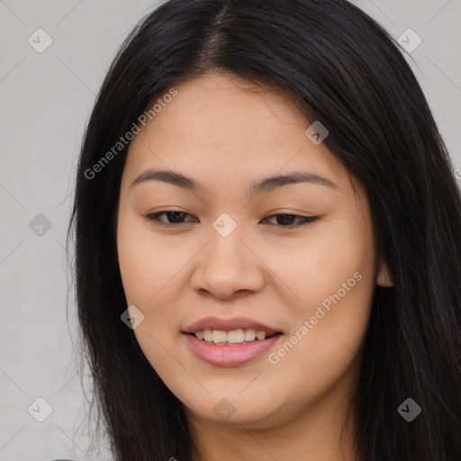 Joyful asian young-adult female with long  brown hair and brown eyes