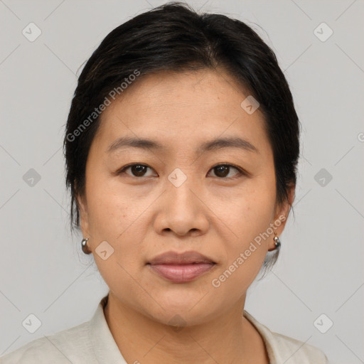 Joyful asian young-adult female with medium  brown hair and brown eyes