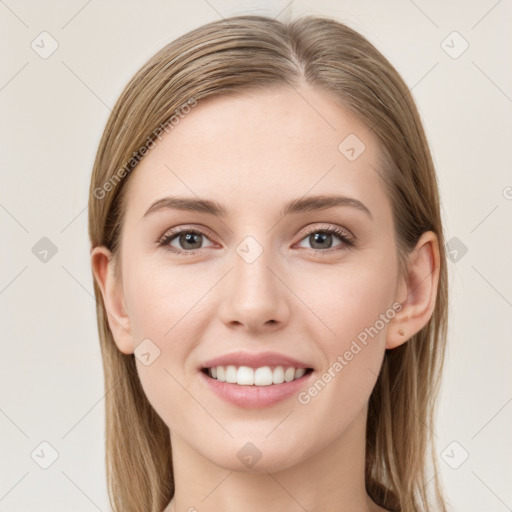 Joyful white young-adult female with long  brown hair and grey eyes