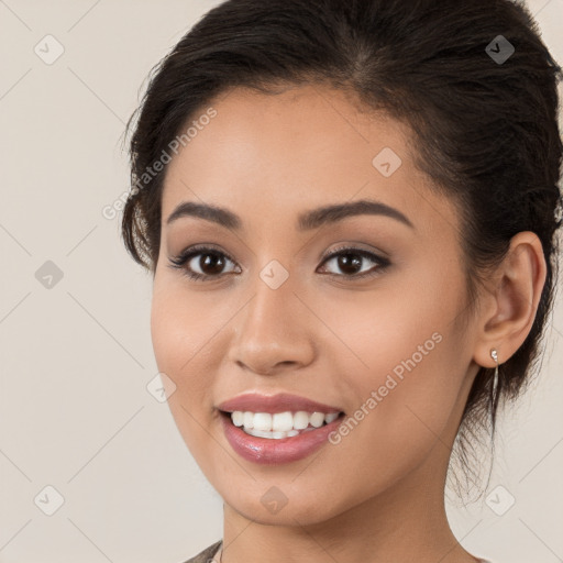 Joyful white young-adult female with long  brown hair and brown eyes