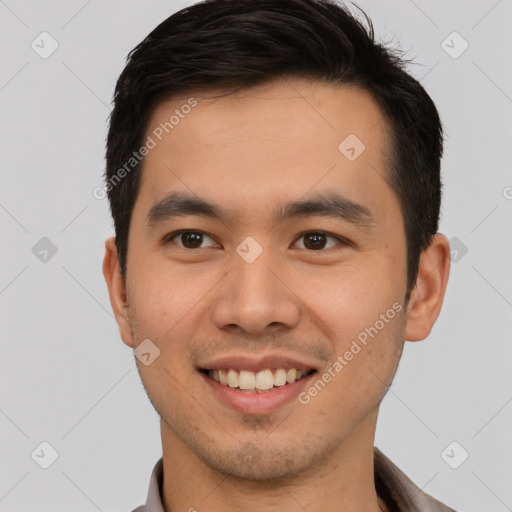 Joyful latino young-adult male with short  brown hair and brown eyes