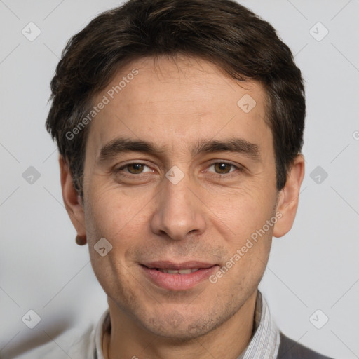 Joyful white adult male with short  brown hair and brown eyes