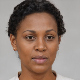 Neutral black young-adult female with short  brown hair and brown eyes