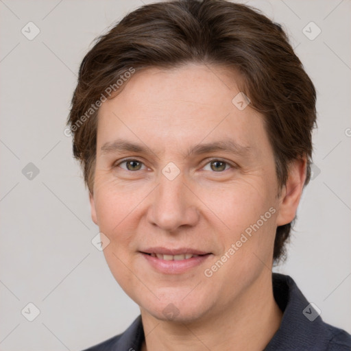 Joyful white adult female with short  brown hair and grey eyes