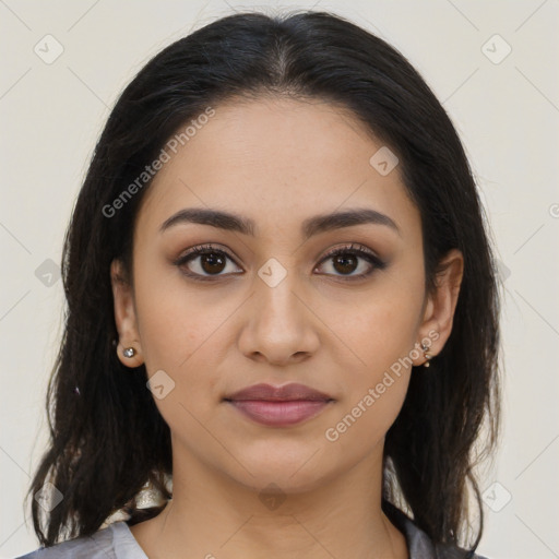 Joyful latino young-adult female with medium  brown hair and brown eyes