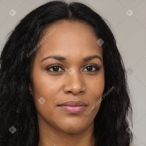 Joyful black young-adult female with long  brown hair and brown eyes