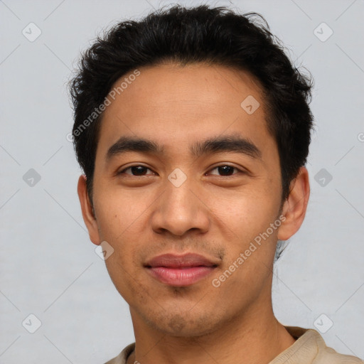 Joyful latino young-adult male with short  black hair and brown eyes