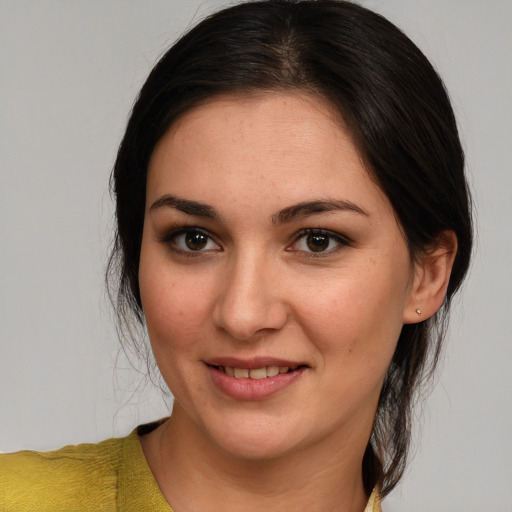 Joyful white young-adult female with medium  brown hair and brown eyes