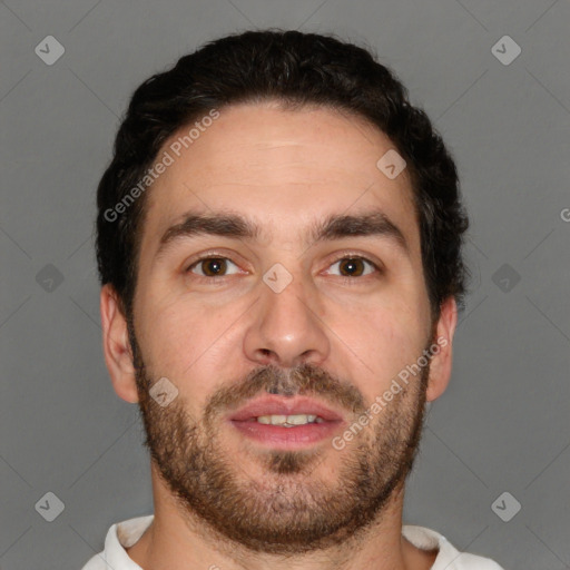 Joyful white young-adult male with short  brown hair and brown eyes