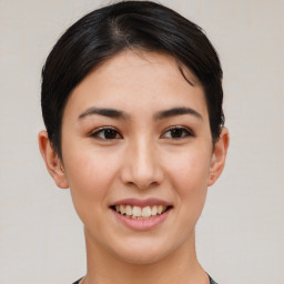 Joyful asian young-adult female with short  black hair and brown eyes