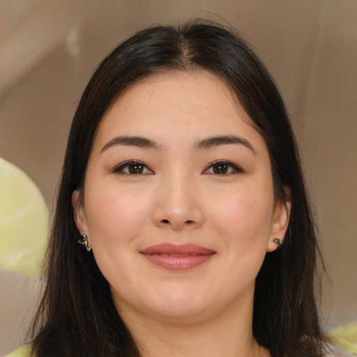 Joyful asian young-adult female with long  brown hair and brown eyes