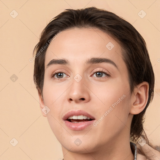 Joyful white young-adult female with medium  brown hair and brown eyes