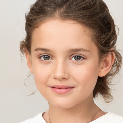 Joyful white child female with medium  brown hair and brown eyes