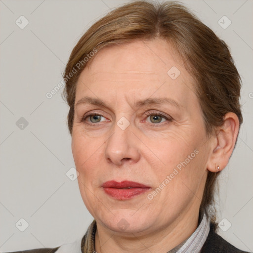 Joyful white adult female with medium  brown hair and grey eyes