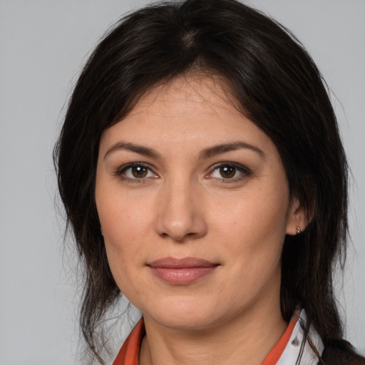 Joyful white young-adult female with medium  brown hair and brown eyes