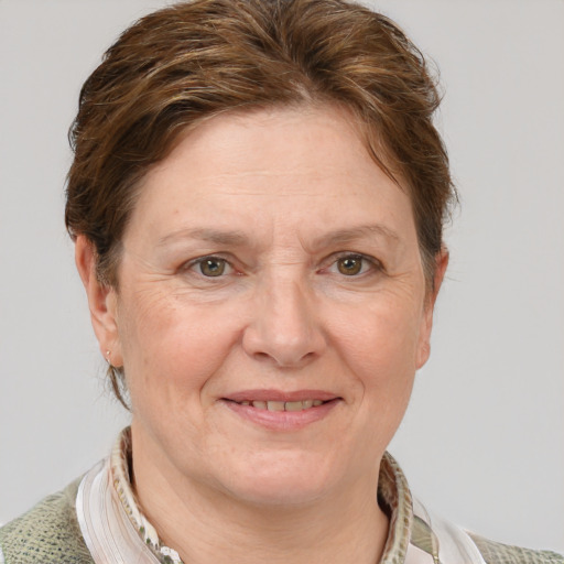 Joyful white adult female with medium  brown hair and grey eyes