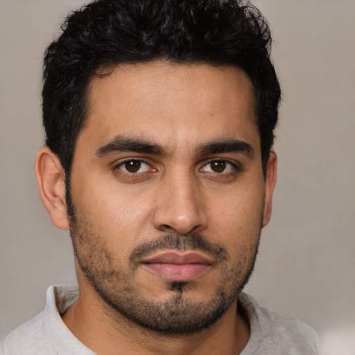 Neutral latino young-adult male with short  brown hair and brown eyes