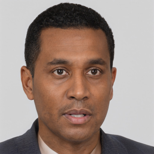 Neutral black young-adult male with short  black hair and brown eyes