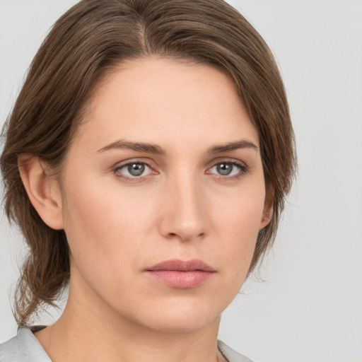 Neutral white young-adult female with medium  brown hair and grey eyes